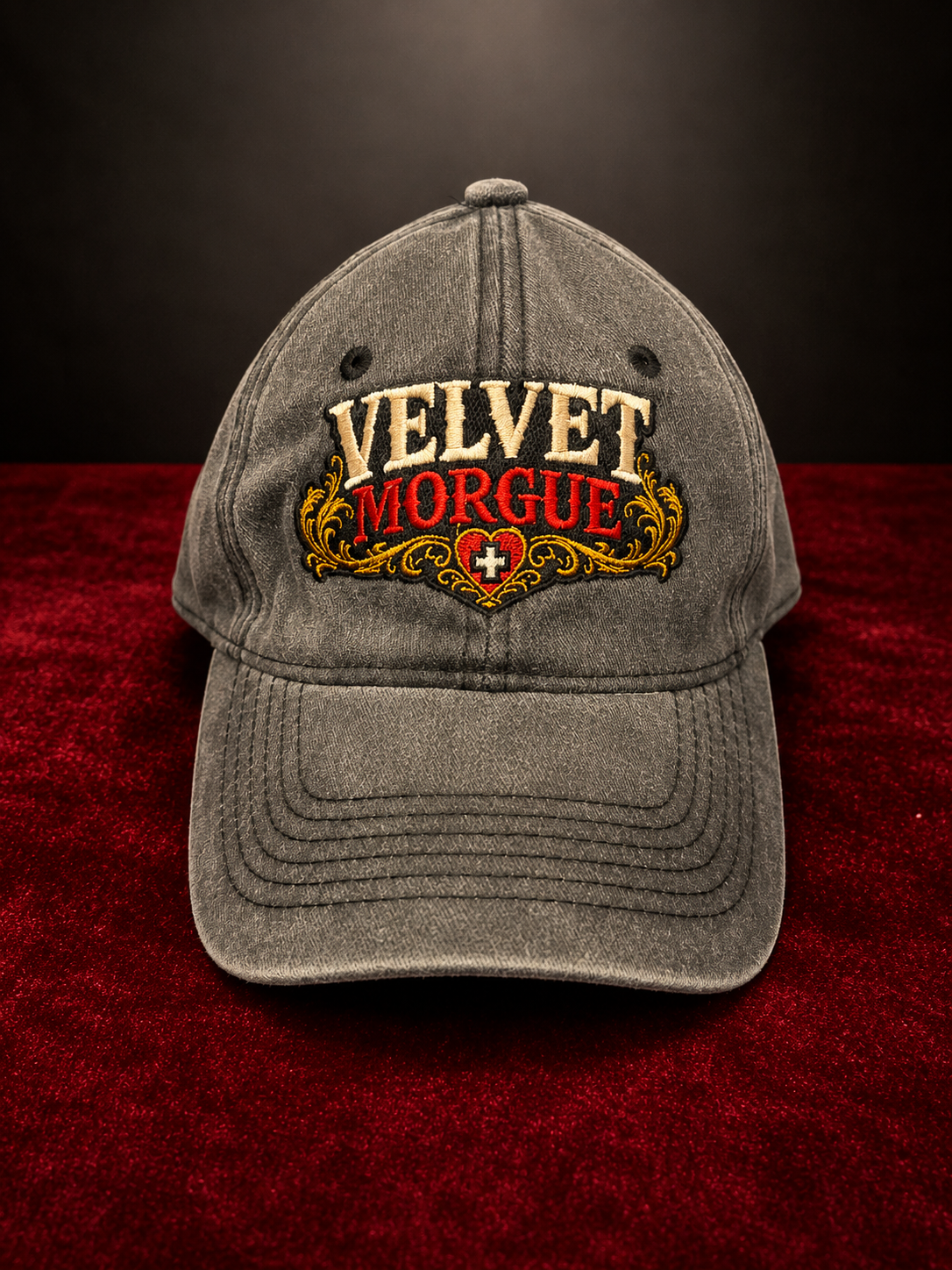 Velvet Morgue embroidered dad hat on red velvet with black background